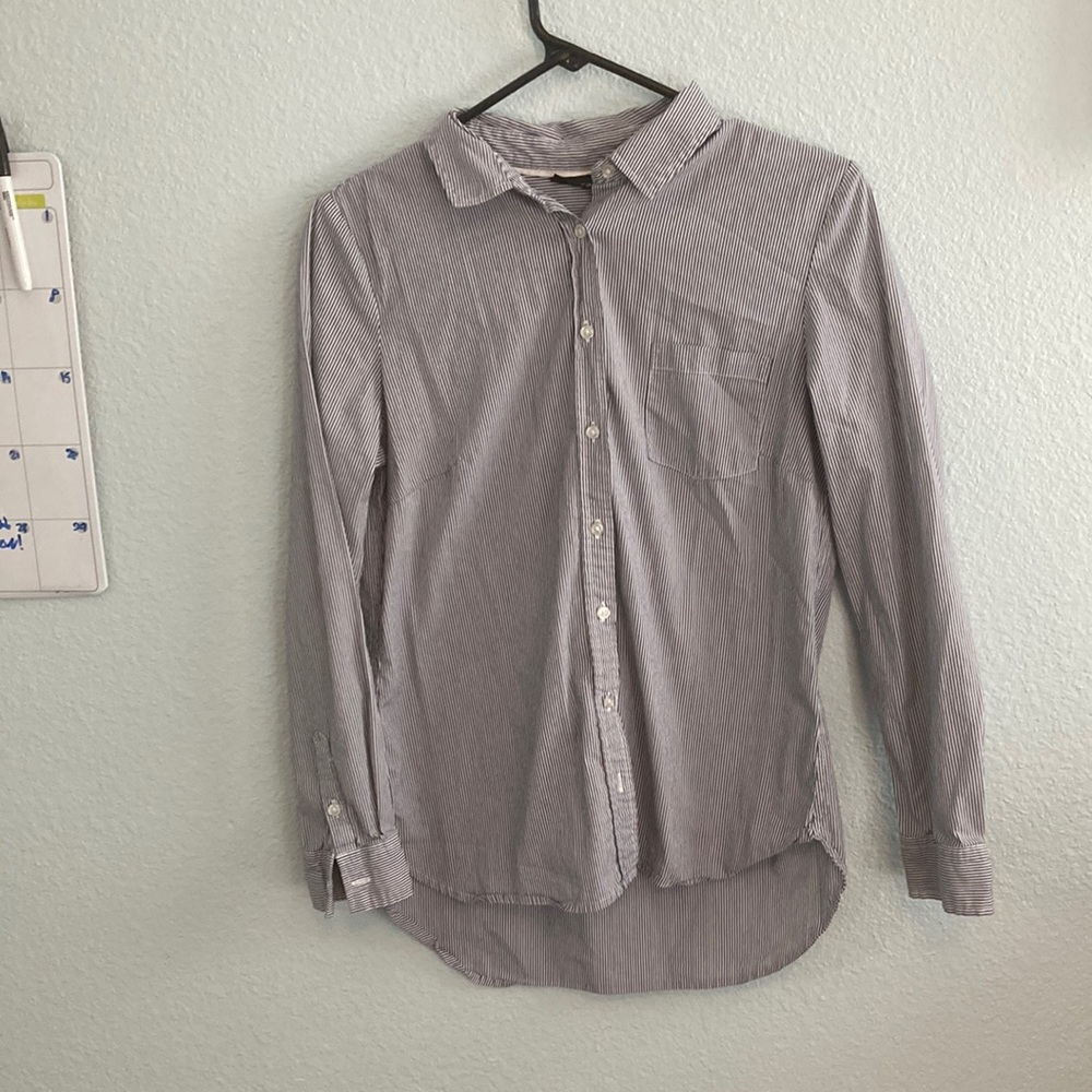 A black and white striped, medium Apt.9 long sleeve women’s buttoned dress shirt